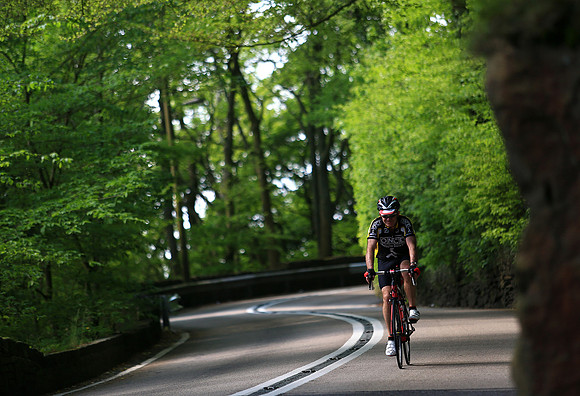 Cycling through woods above Hebden Bridge