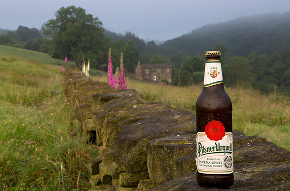 Pilsner Urquell on stone wall