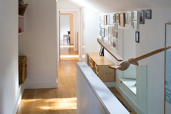 Full length of mews corridor bathed in natural light